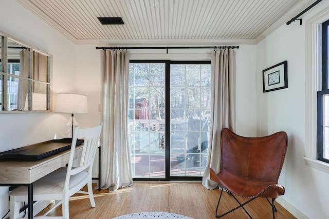 interior space with visible vents, wood ceiling, wood finished floors, and crown molding