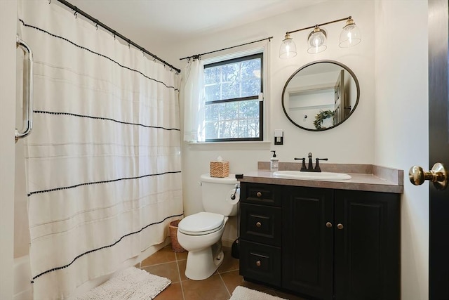 bathroom with tile patterned floors, toilet, and vanity