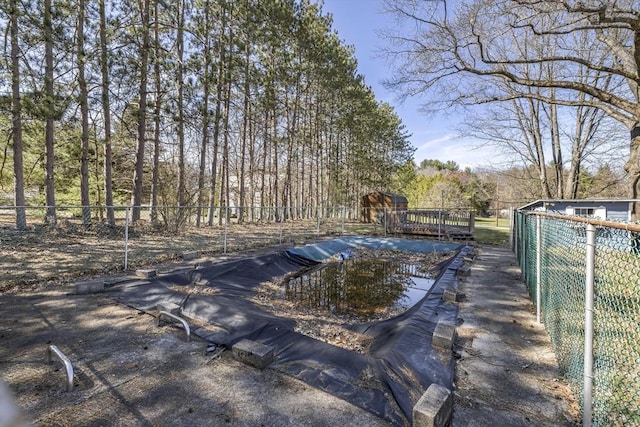 view of pool with fence