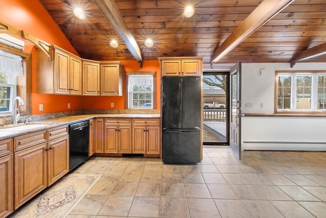 kitchen featuring sink, baseboard heating, lofted ceiling with beams, black appliances, and a healthy amount of sunlight