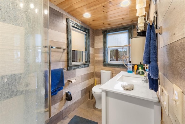 bathroom with tile walls, vanity, toilet, a shower with door, and wooden ceiling