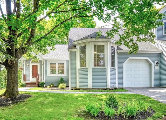 9 Knollwood Ct Unit 9, Burlington, MA 01803 - view of front of home with a shingled roof, an attached garage, asphalt driveway, and a front lawn