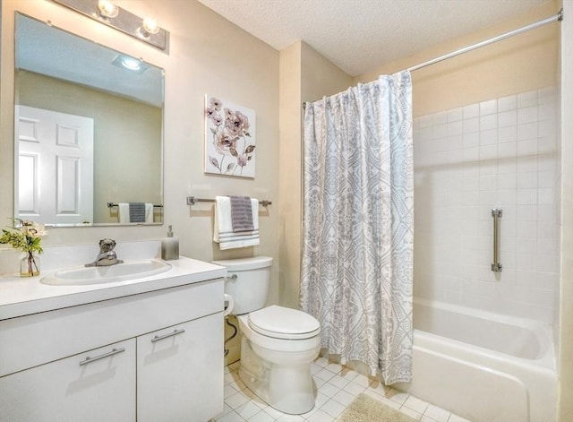 9 Knollwood Ct Unit 9, Burlington, MA 01803 - bathroom with vanity, toilet, tile patterned flooring, shower / tub combo, and a textured ceiling