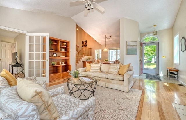9 Knollwood Ct Unit 9, Burlington, MA 01803 - living area with wood finished floors, stairs, lofted ceiling, a ceiling fan, and baseboards