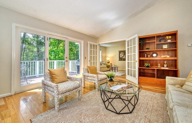 9 Knollwood Ct Unit 9, Burlington, MA 01803 - living room with french doors, light wood-type flooring, vaulted ceiling, and baseboards