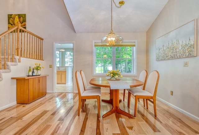 9 Knollwood Ct Unit 9, Burlington, MA 01803 - dining space featuring light wood finished floors, stairway, healthy amount of natural light, a chandelier, and vaulted ceiling