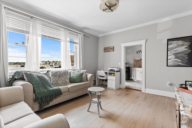 living room with crown molding, light wood-style flooring, and baseboards