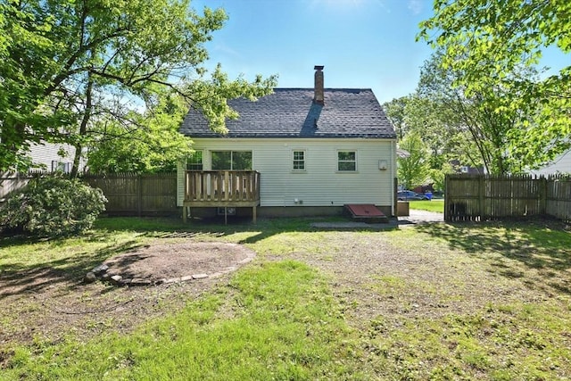 248 Pheland St, Springfield, MA 01109 - rear view of property with a chimney and roof with shingles