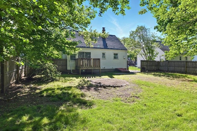 248 Pheland St, Springfield, MA 01109 - rear view of house featuring a deck, a chimney, and roof with shingles