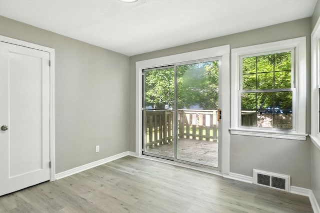 248 Pheland St, Springfield, MA 01109 - spare room featuring plenty of natural light, wood finished floors, and baseboards