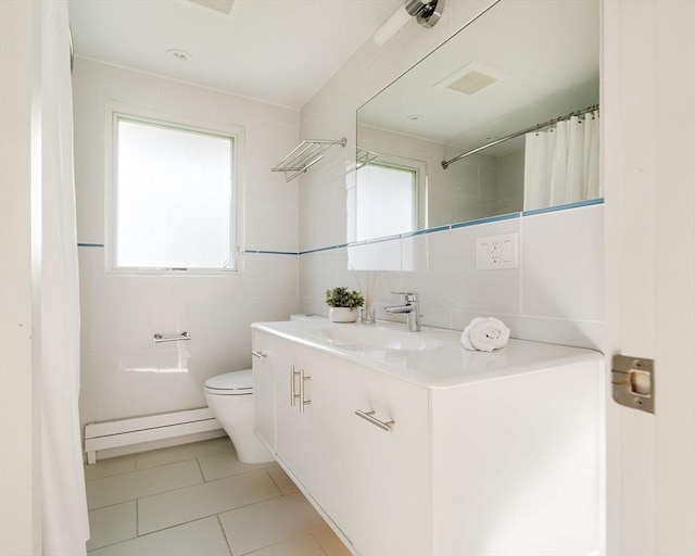 full bath featuring baseboard heating, toilet, tile patterned floors, vanity, and a shower with curtain