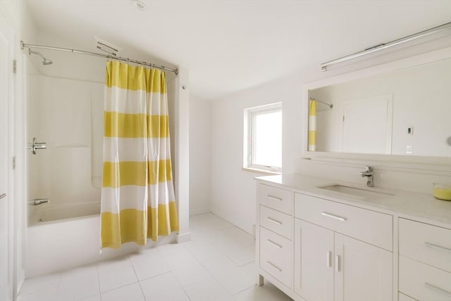 full bath with shower / bath combo with shower curtain, vanity, and tile patterned flooring
