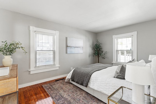 bedroom with hardwood / wood-style floors