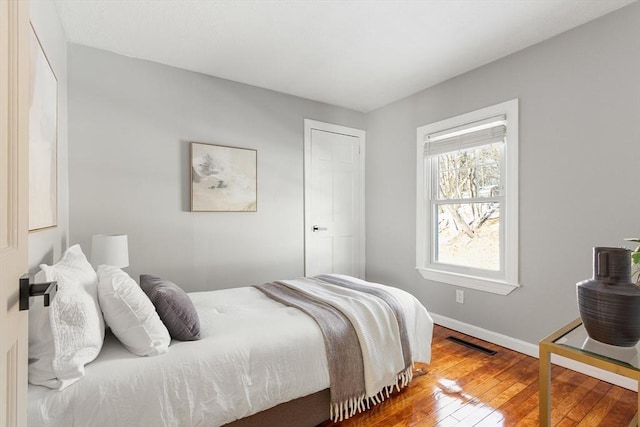 bedroom featuring hardwood / wood-style flooring