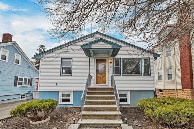 bungalow-style house featuring entry steps