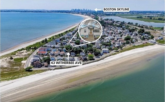 aerial view featuring a water view and a view of the beach
