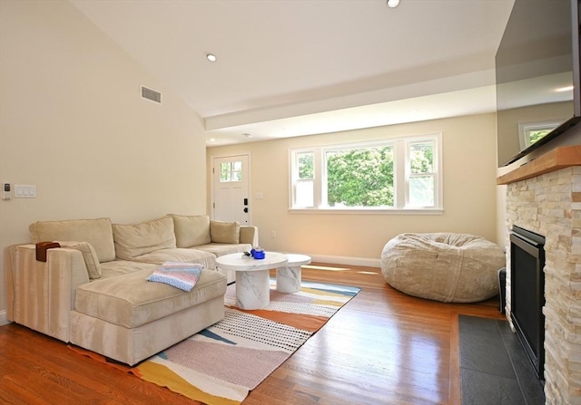 11 Edith Rd, Hudson, MA 01749 - living area with a fireplace, wood finished floors, lofted ceiling, baseboards, and recessed lighting