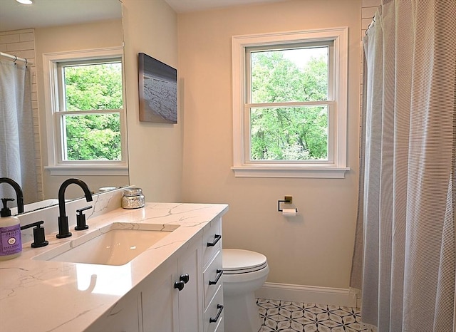 11 Edith Rd, Hudson, MA 01749 - bathroom featuring vanity, toilet, a heating unit, tile patterned floors, and baseboards