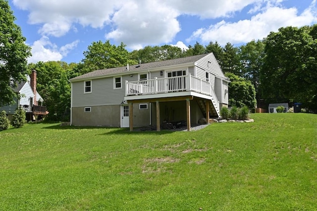 11 Edith Rd, Hudson, MA 01749 - back of property with a deck, a lawn, and stairs