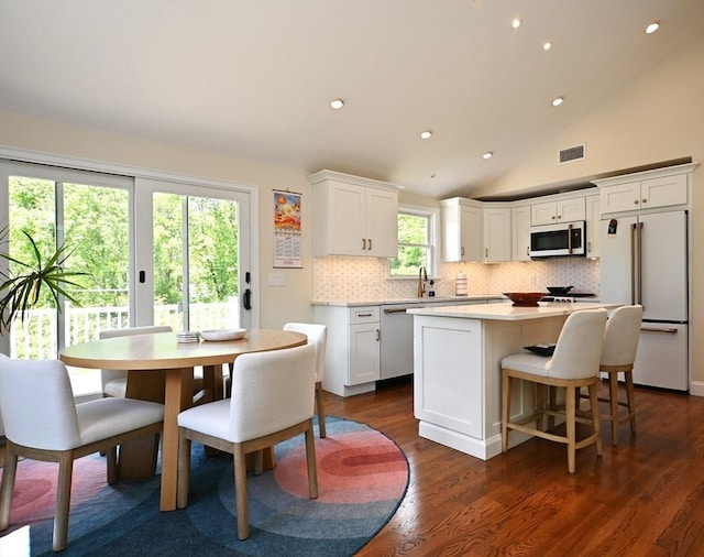 11 Edith Rd, Hudson, MA 01749 - kitchen featuring high end white fridge, dishwasher, a kitchen island, white cabinetry, and tasteful backsplash