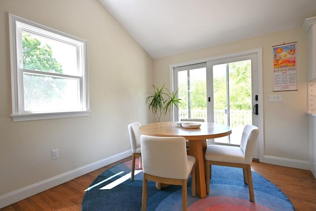 11 Edith Rd, Hudson, MA 01749 - dining area featuring vaulted ceiling, baseboards, and wood finished floors