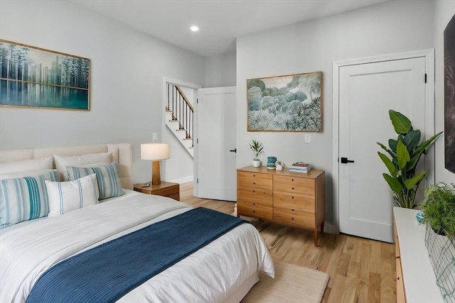 bedroom featuring recessed lighting and light wood-style flooring