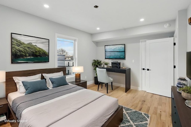 bedroom featuring recessed lighting, baseboards, and light wood-type flooring