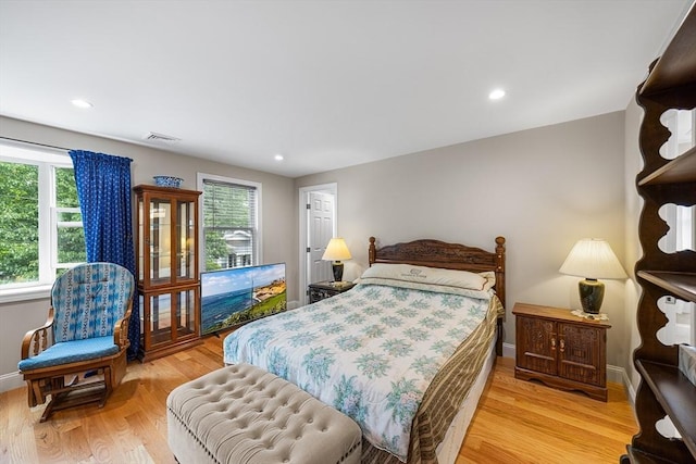 26 Weybosset St, Weymouth, MA 02191 - bedroom with multiple windows, wood finished floors, recessed lighting, and baseboards