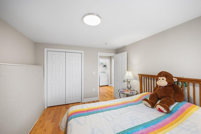 26 Weybosset St, Weymouth, MA 02191 - bedroom featuring washer / clothes dryer, wood finished floors, and a closet
