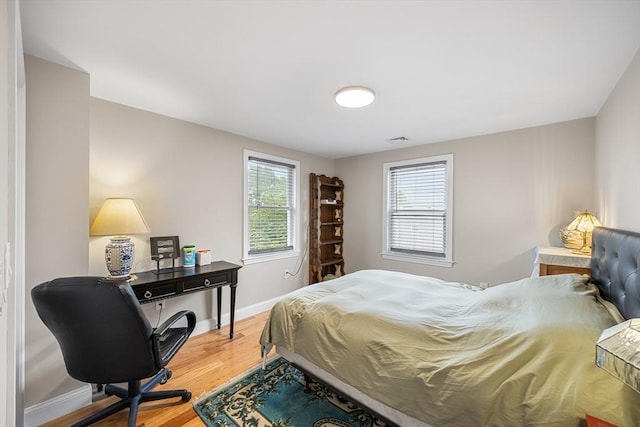 26 Weybosset St, Weymouth, MA 02191 - bedroom featuring wood finished floors, baseboards, and a desk