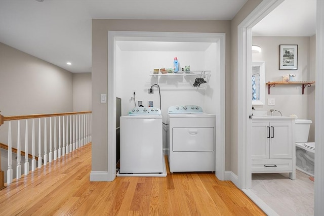 26 Weybosset St, Weymouth, MA 02191 - laundry area featuring washing machine and clothes dryer, light wood-style flooring, baseboards, and recessed lighting