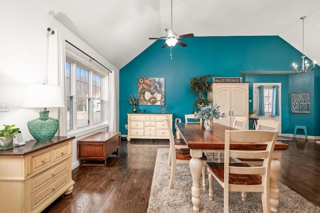 dining room with dark wood-style floors, vaulted ceiling, baseboards, and ceiling fan with notable chandelier