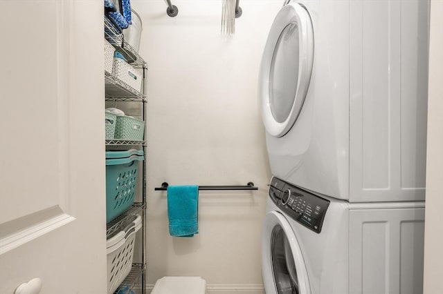 laundry area with laundry area and stacked washer and clothes dryer