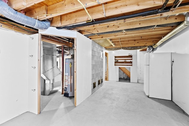 basement featuring heating unit and water heater