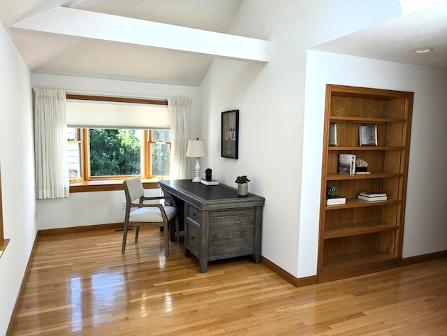 office featuring light wood-type flooring and vaulted ceiling