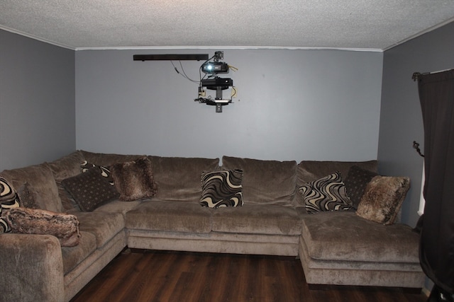 living room featuring a textured ceiling, crown molding, and dark wood-type flooring