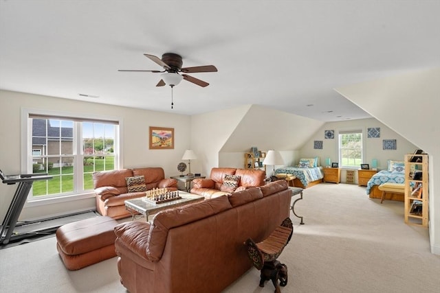 living area with carpet floors, a ceiling fan, and lofted ceiling