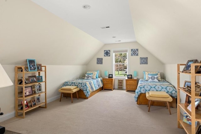 bedroom with lofted ceiling, carpet floors, and baseboards