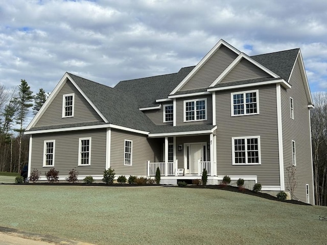 view of front of property with a front lawn and a porch