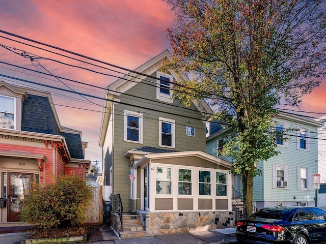 102 Gilman St, Somerville, MA 02145 - american foursquare style home featuring cooling unit and stone siding