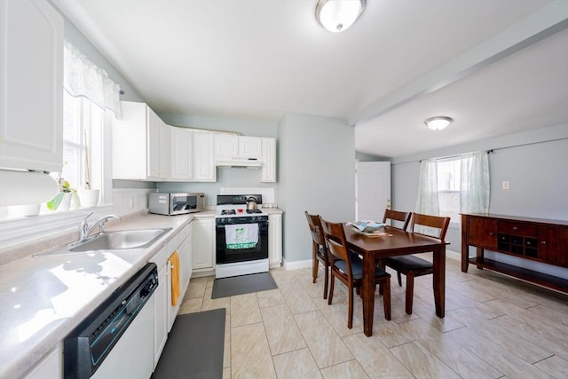 102 Gilman St, Somerville, MA 02145 - kitchen featuring white appliances, a sink, light countertops, and white cabinets