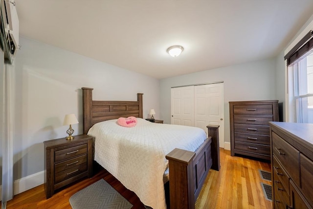 102 Gilman St, Somerville, MA 02145 - bedroom featuring light wood finished floors, a closet, and baseboards