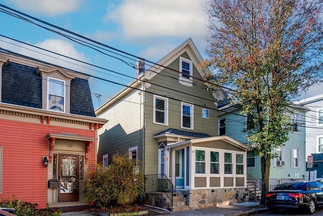102 Gilman St, Somerville, MA 02145 - view of front of house featuring roof with shingles, mansard roof, and entry steps
