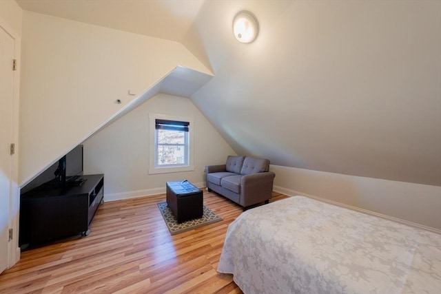 102 Gilman St, Somerville, MA 02145 - bedroom with lofted ceiling, light wood-type flooring, and baseboards