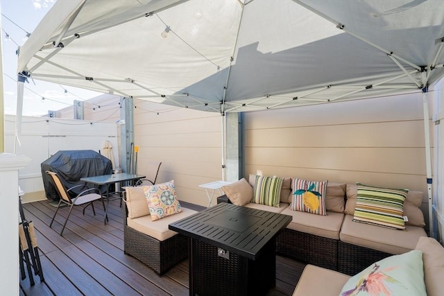 102 Gilman St, Somerville, MA 02145 - wooden deck featuring outdoor lounge area, fence, and outdoor dining area