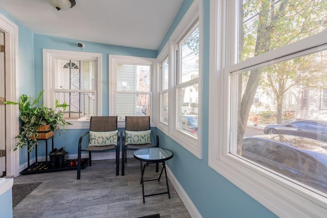102 Gilman St, Somerville, MA 02145 - sunroom / solarium with baseboards and wood finished floors