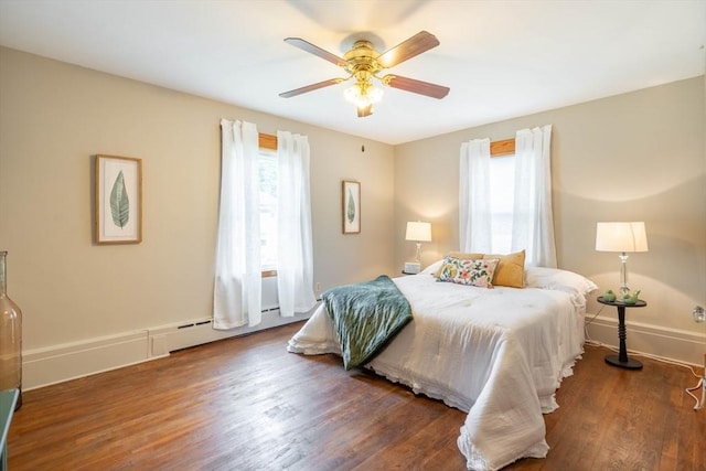 7 Prospect Ave, Dudley, MA 01571 - bedroom featuring wood finished floors, a ceiling fan, baseboards, and a baseboard heating unit