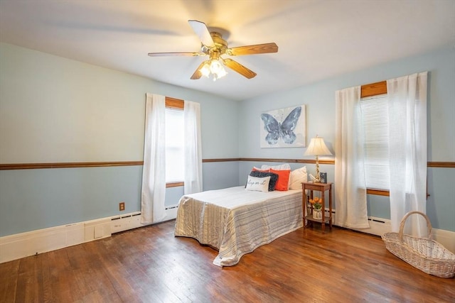 7 Prospect Ave, Dudley, MA 01571 - bedroom with wood finished floors, a baseboard heating unit, and a ceiling fan