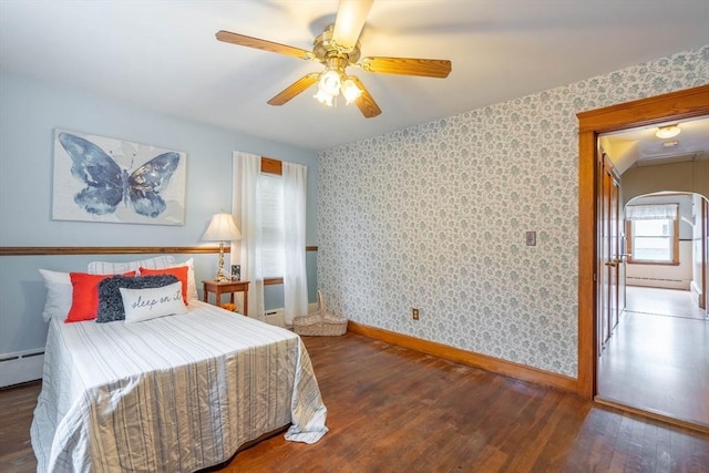 7 Prospect Ave, Dudley, MA 01571 - bedroom featuring wallpapered walls, baseboards, wood finished floors, a baseboard heating unit, and a ceiling fan