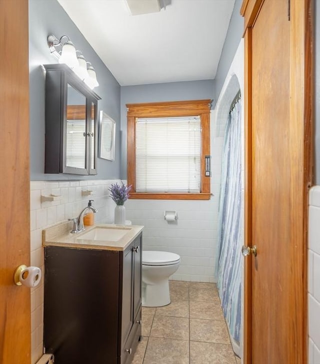 7 Prospect Ave, Dudley, MA 01571 - full bathroom with tile walls, toilet, tile patterned floors, vanity, and a shower with curtain